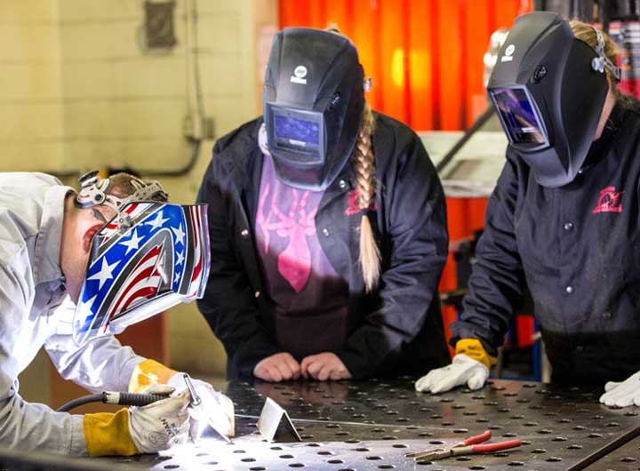 Students observing welding