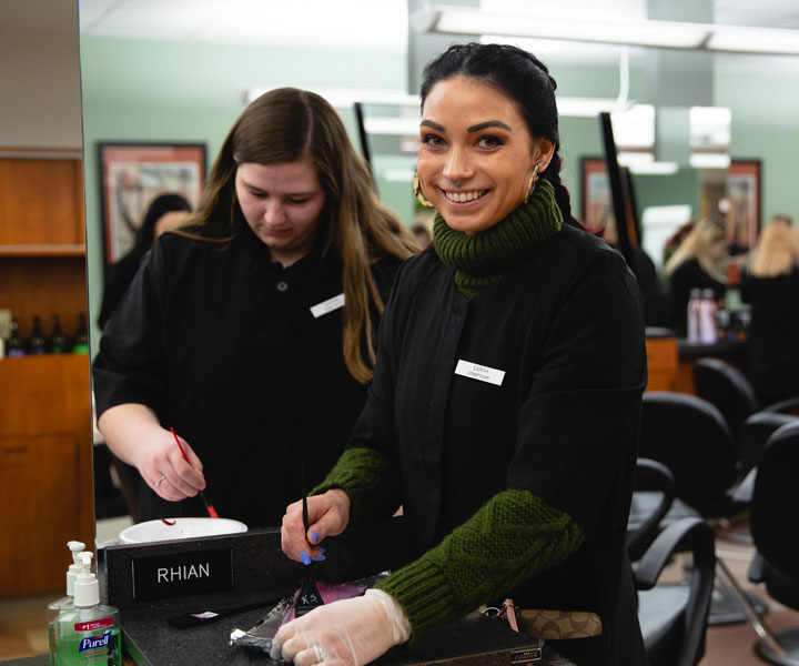 Beauticians mixing hair dye
