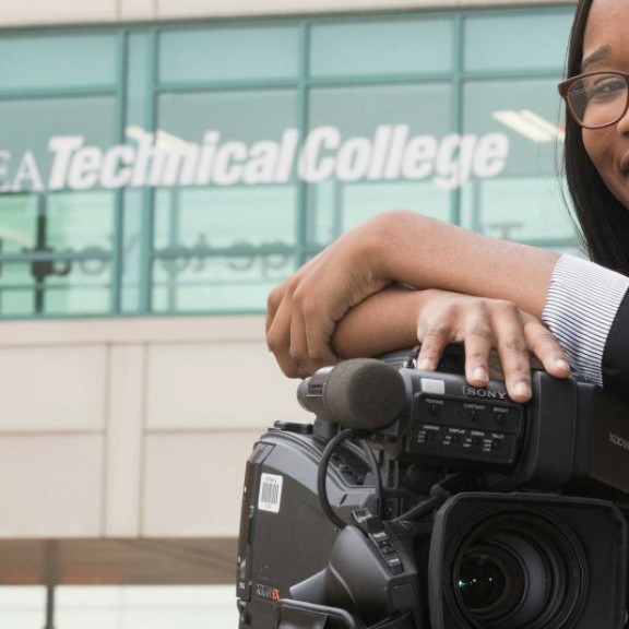 MATC student smiling with film equipment