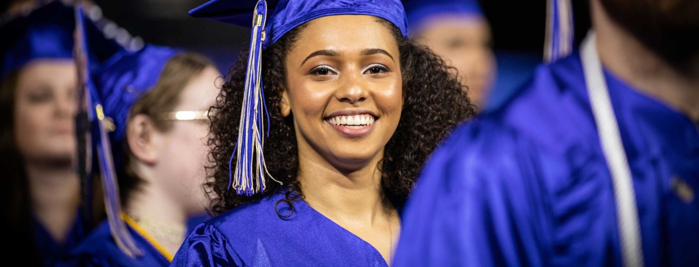 Graduate smiling at ceremony
