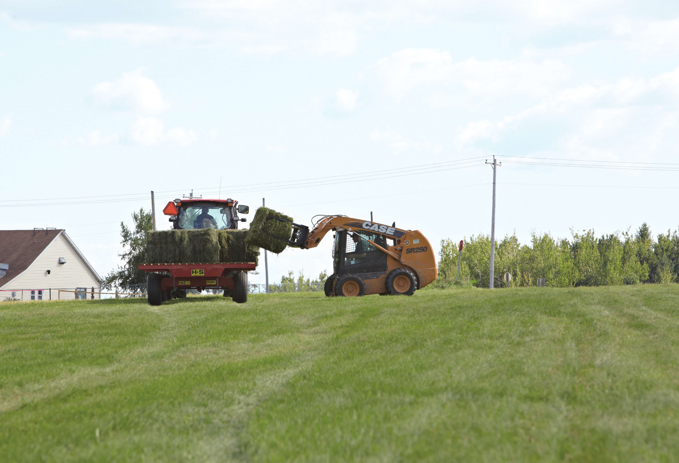 agribusiness - tractors baling hay