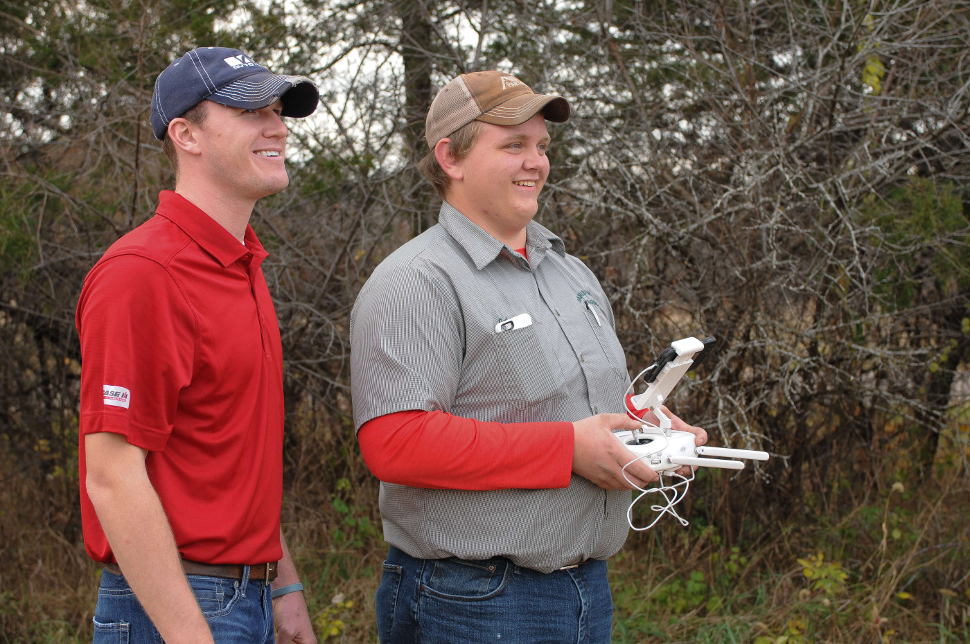 Two ag students using drones for precision